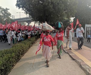 Many women easily walked balancing their luggage on the their heads.