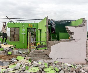 Anil’s father, B.Ramesh, and his mother, B.Venkatalakshmi,  setting up a shelter in their collapsed home