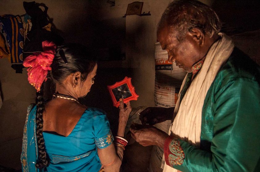 A Man helping dancer getting ready before her performance