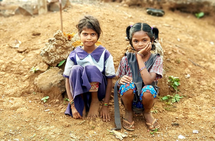 Young girls in this hamlet are passing their days caring for their younger siblings.