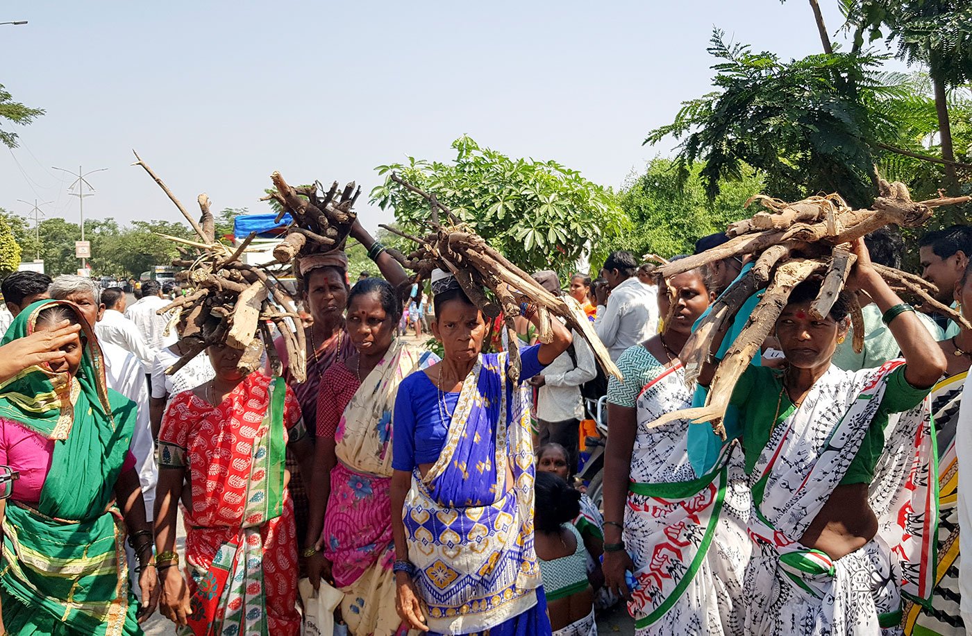 women with firewood on there head 