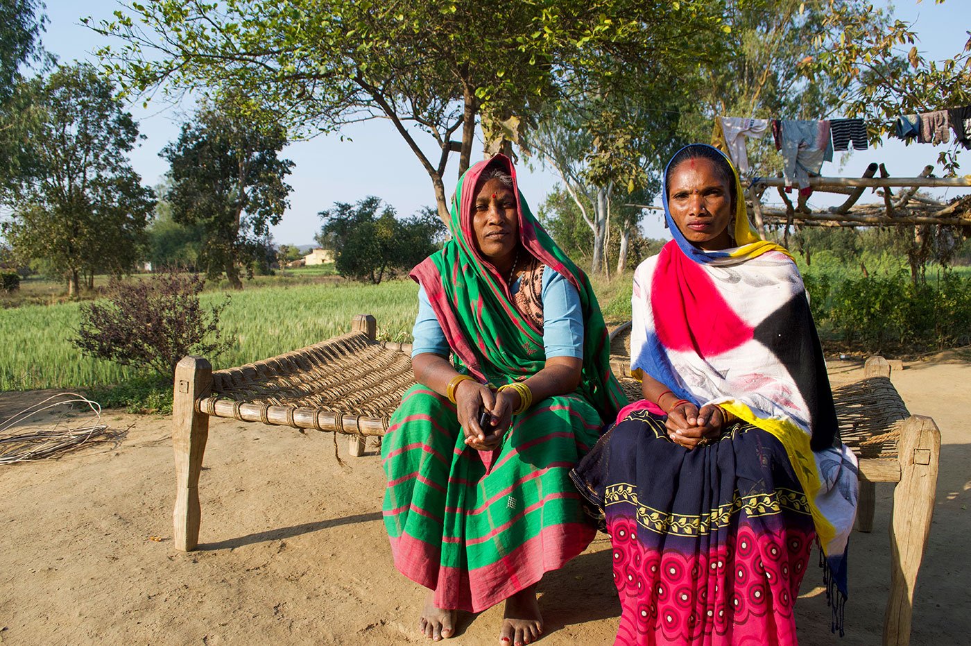 Sukalo (left) and Keesmati sitting outside Sukalo’s home