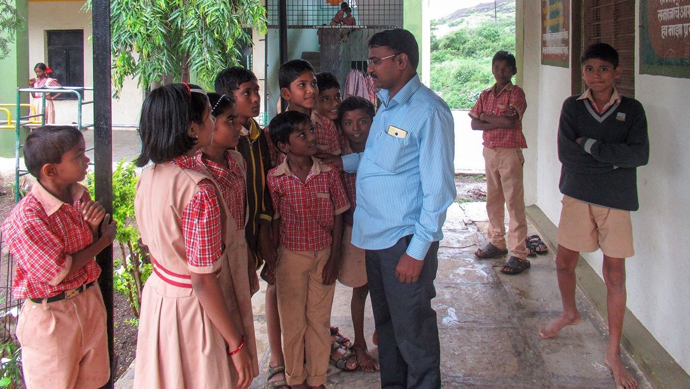 Students talking to their teacher