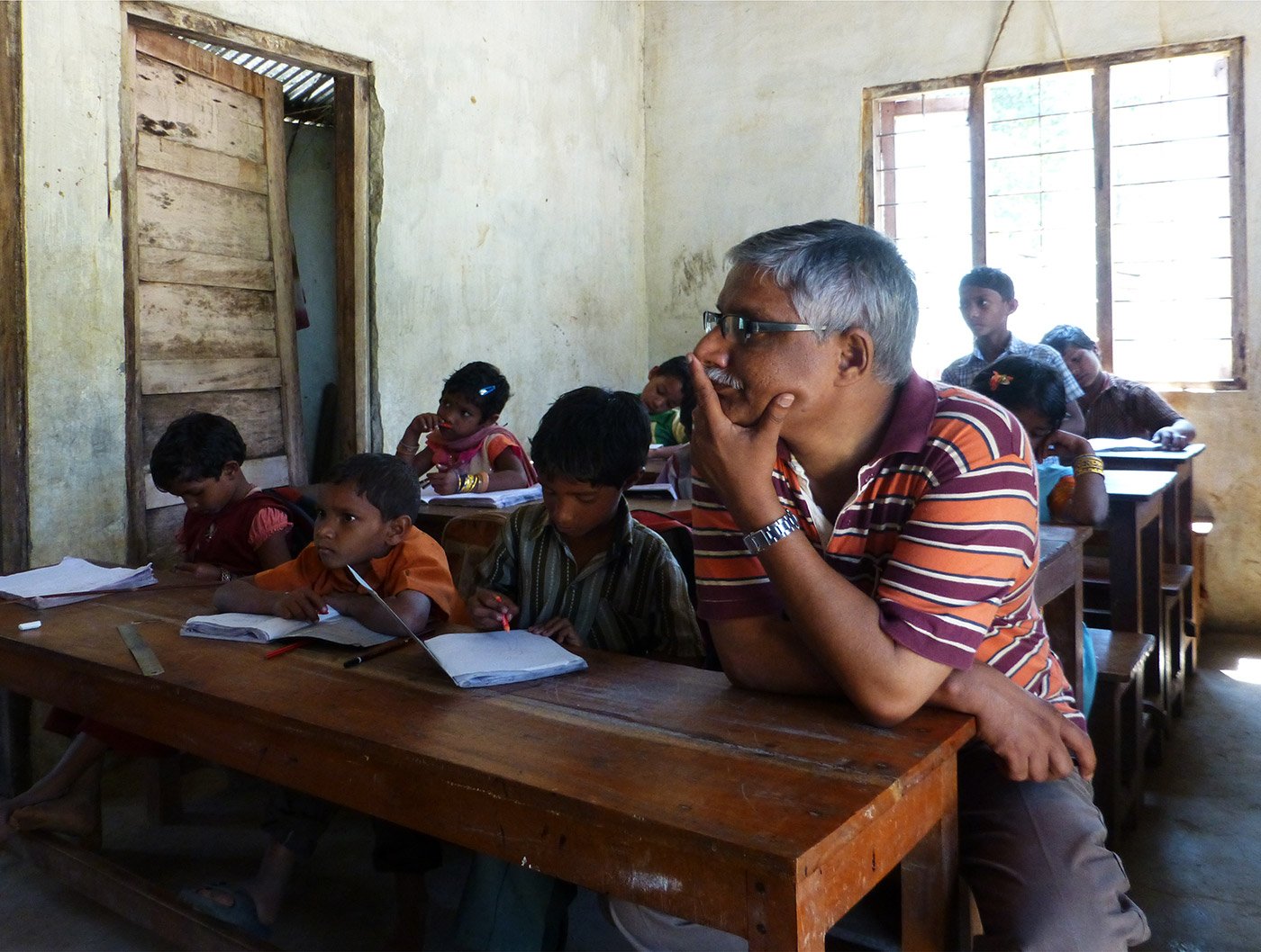 classroom full of boy students narrating poem