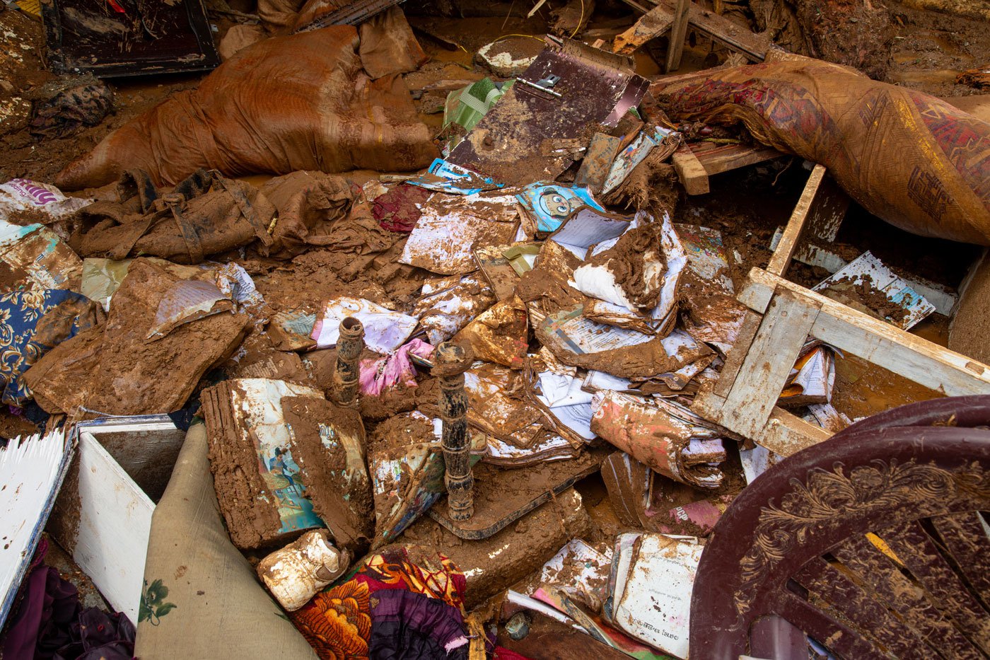 When homes fell, families lost everything, their belongings buried in wet soil