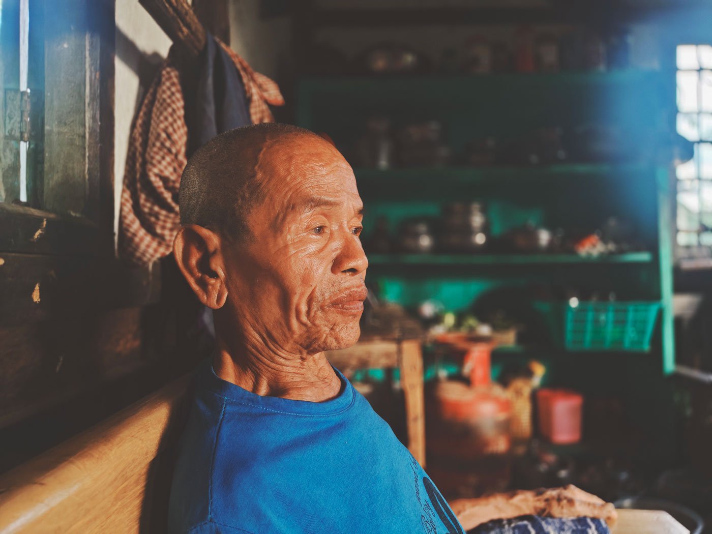 Khuma Theik at his brother’s house, after his own home in the Kuki village of Langza was attacked and his son violently killed