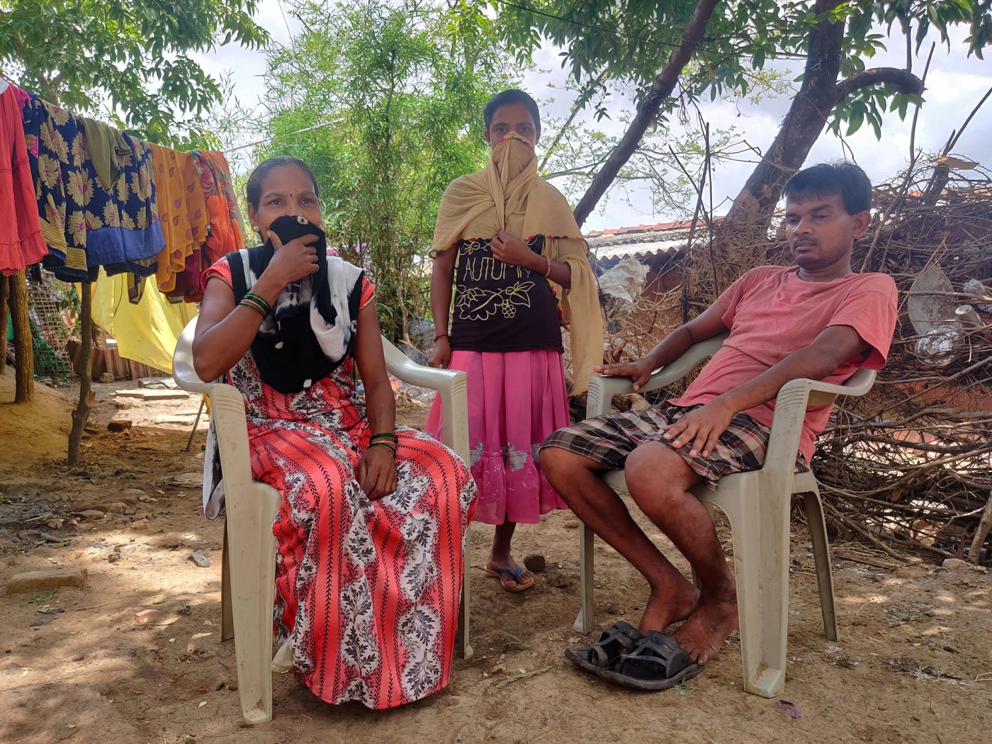 Rajesh Andhare, a labourer, spent a month's earnings to buy a smartphone for his son Dinesh. Here, with his wife Chandan and their daughter Anita, who is doubtful about learning through  a phone

