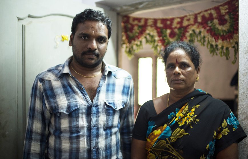 A man and a woman standing in a doorway