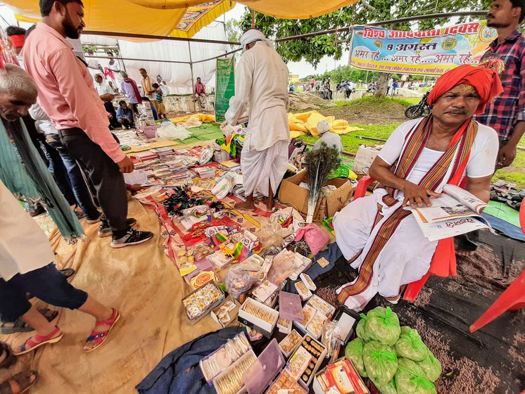 Rampyari Kawachi (right) selling books and other materials during World Tribal Day celebrations in Dhamtari, Chhattisgarh, in 2019.