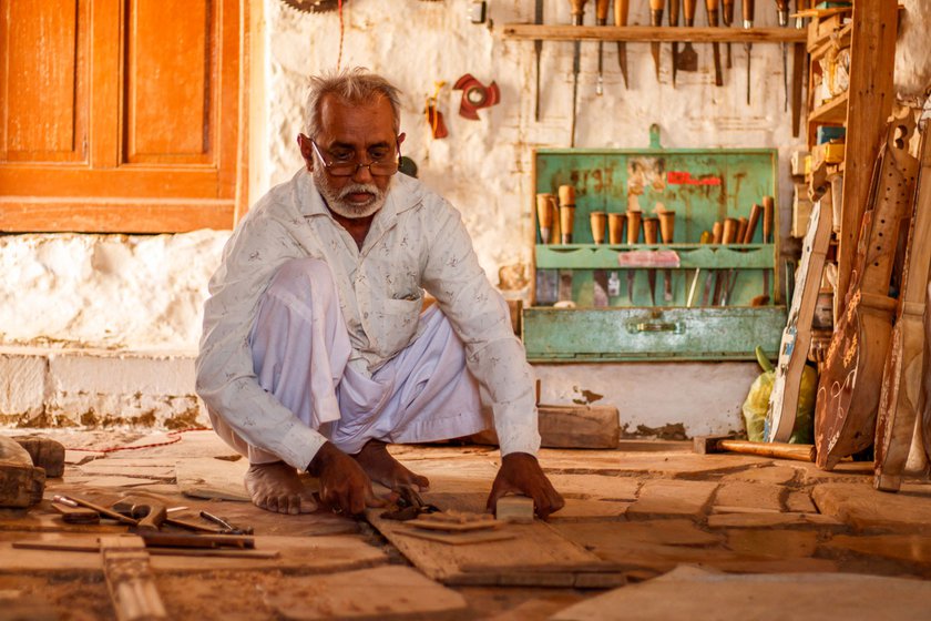 Left: Anoparam Sutar says selecting the right wood is crucial in handmaking a khartal .