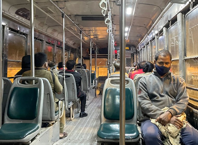 Mithun Kumar (facing the camera) in a BEST bus, on his way to the vegetable market