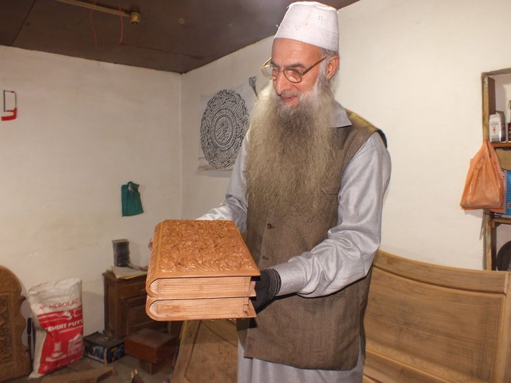 Ghulam Nabi Dar carves a jewelry box (right) in his workshop at home