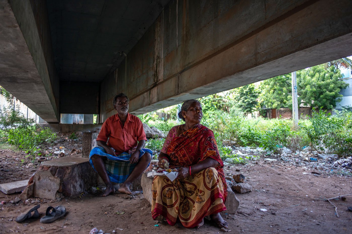 Sitting under the Singarathope bridge, Kala is eating lunch from a nearby eatery. She says, ' A meal costs around Rs. 30 to 40, depending on whether I take a curry in addition to a piece of fish. Often it is late by the time I get to eat'