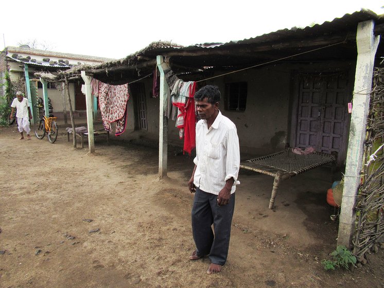 A man limping towards his home 