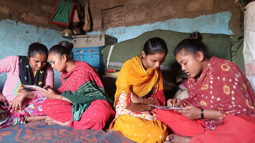 Women reading the Gujarati bimonthly magazine Bol samantana (Words of equality)