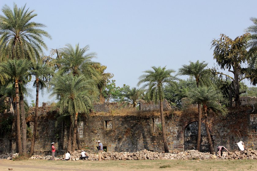 Stone cutters chiseling, cutting and giving shapes to the stones at the Vasai fort.