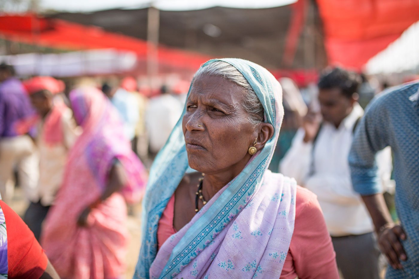 A woman in a sari with the pallu over her head