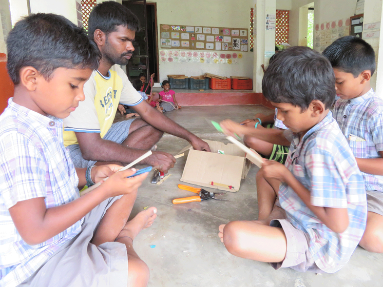 M. Sakthivel teaching children at the Thulir school