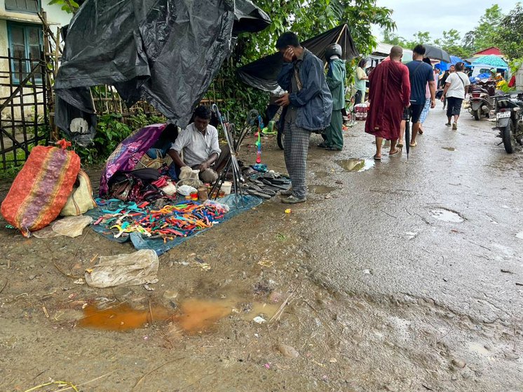 Left: At the market entrance, cobblers are busy repairing shoes, chappals and umbrellas.