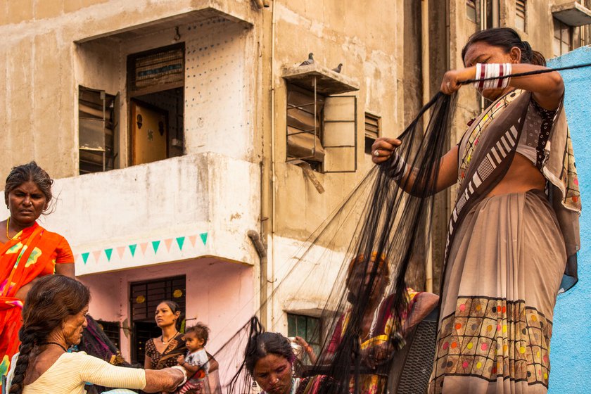 Left: Karuna Rajbhoi and others twist strands of fibre into a rope.