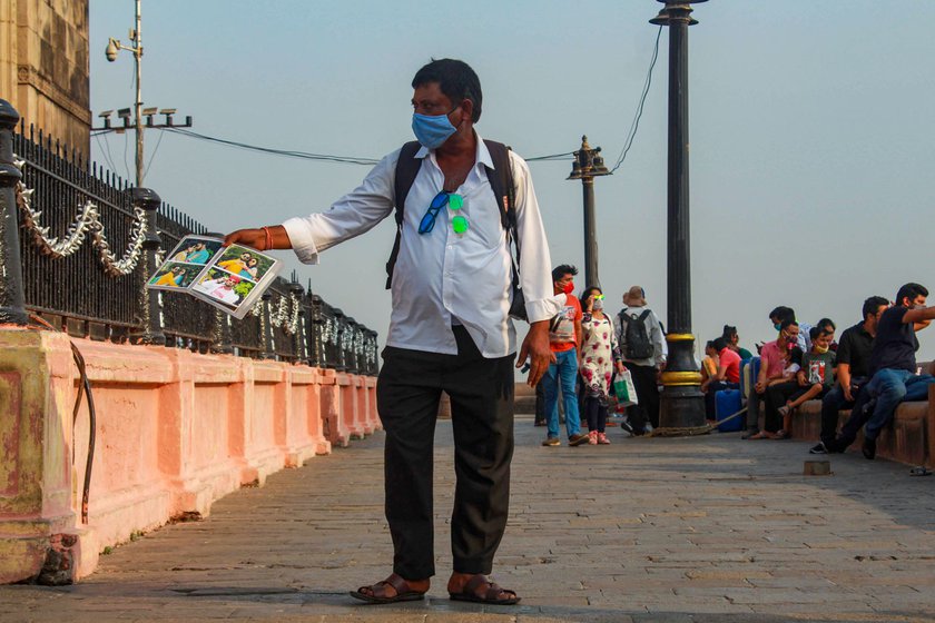 It's become harder and harder to convince potential customers, though some agree to be clicked and want to pose – and the photographer earns Rs. 30 per print