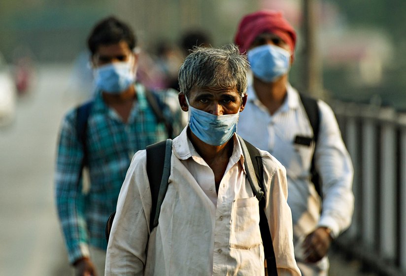 Left: A farmer protesting with chains at Singhu. In the pandemic year, not a paisa's concession was made to farmers by way of guaranteed MSP. Right: Last year, migrants on the outskirts of Nagpur. If India levied wealth tax at just 10 per cent on 140 billionaires, we could run the MGNREGS for six years