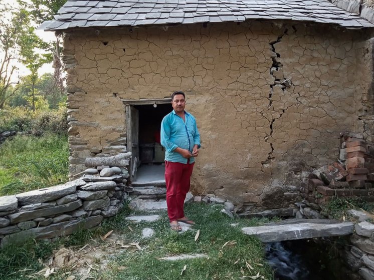 Om Prakash standing outside the mill