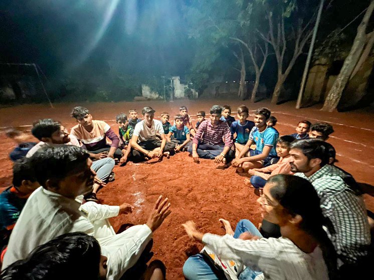 Right: Players sit down after practice to discuss the game