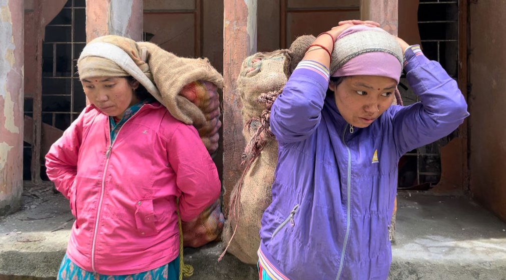 Right: Lakshmi Thami (left) and Rebika Thami (right)  each carrying a sack of potatoes weighing 60 kilos