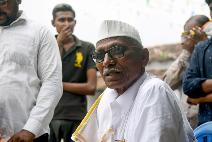 Vitthal Badkhal listens intently to farmers