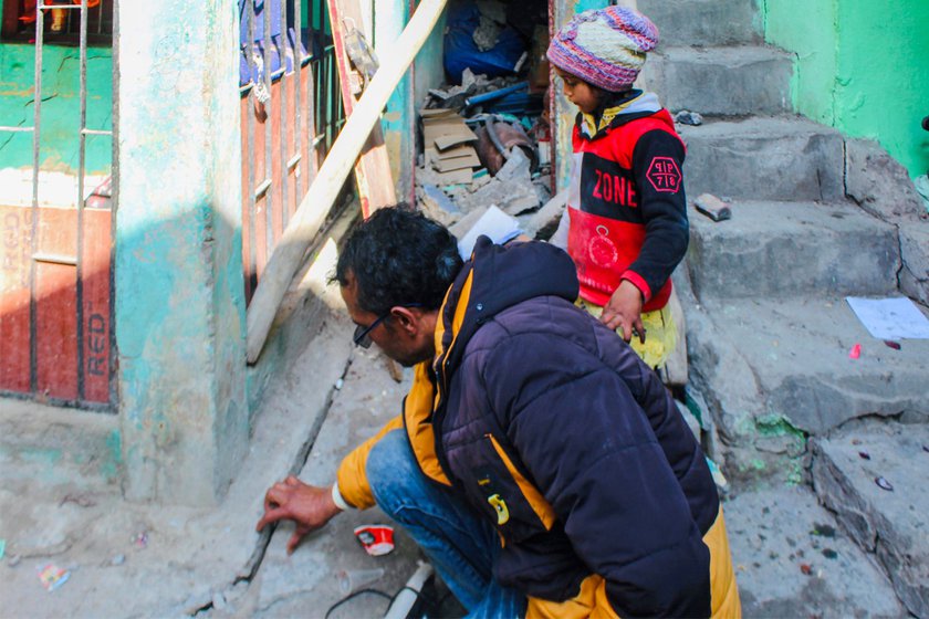 Raghav and Ayesha are examining cracks on the ground in their neighbourhood. He says, ‘My story is the story of all Joshimath.’