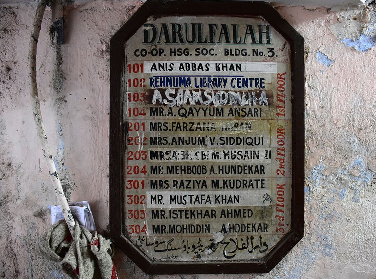 The name plaque in the building with all the residents' name