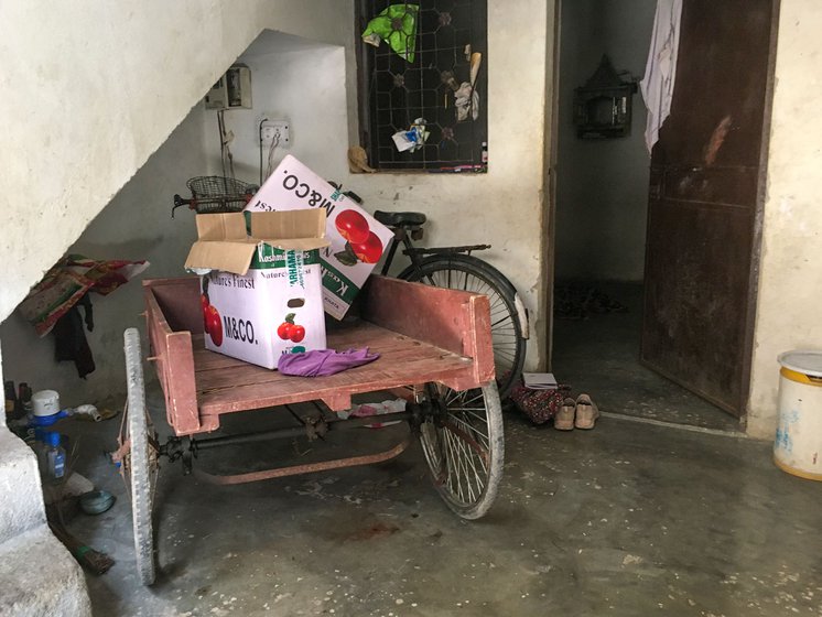 The wooden cart that belongs to Sunita's husband, who is a fruit and vegetable seller.