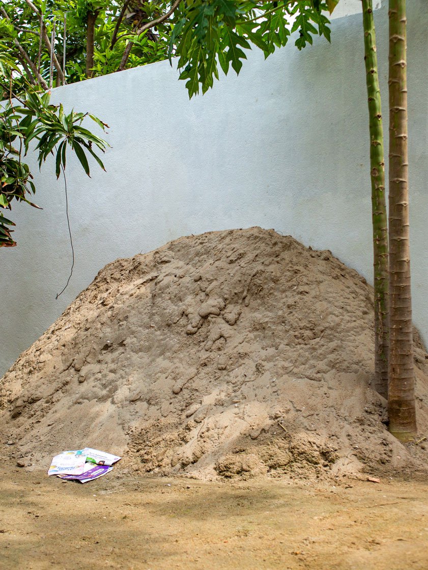 Dilli anna uses clay (left) and husk (right) to make the Kannisamy idols. Both raw materials are available locally, but now difficult to procure with the changes around.