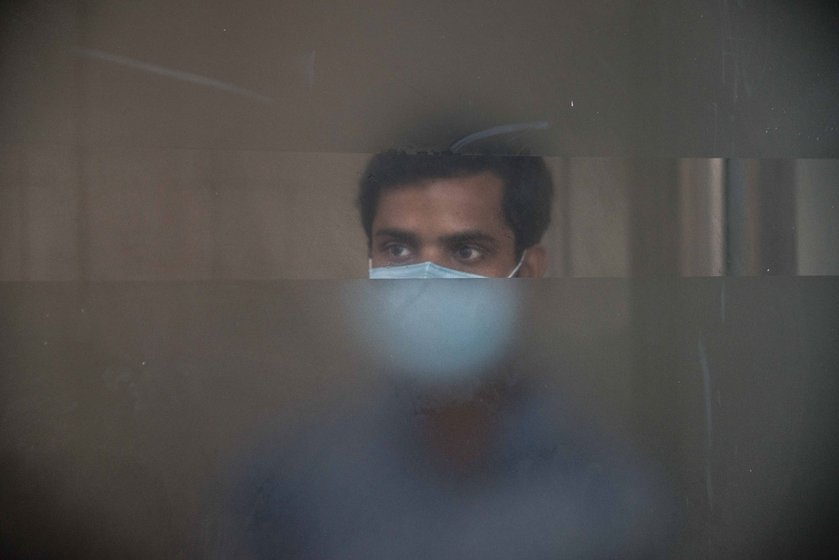 Left: A nurse in the Neonatal Intensive Care Unit (NICU). Despite seeing staff on duty falling to 40 per cent of normal, the hospital soldiers on in providing services for children-left. Right: Health worker hazards: Jayram Sen (name changed) of the ICH was not allowed, for several days, to take water from a community tap in his village in the South 24 Parganas

