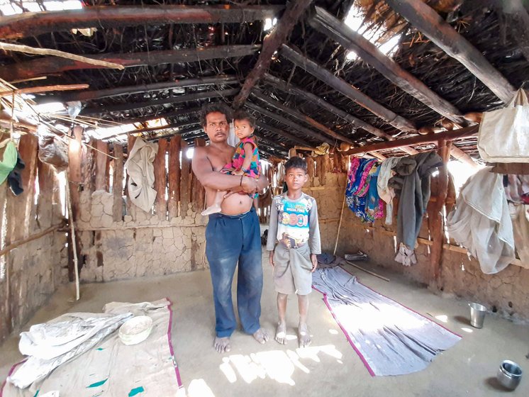 Ghasiram Netam with his daughter and son; his wife was gathering mahua flowers from the forest – they are being forced to sell the mahua at very low rates