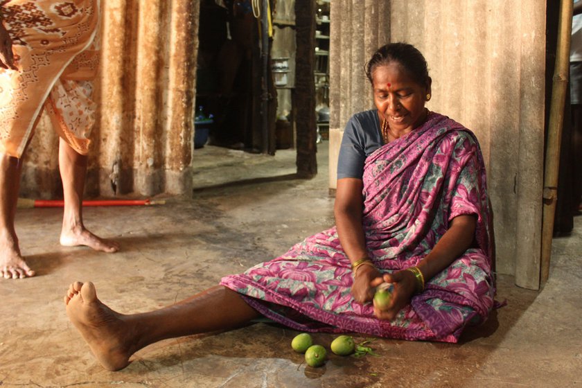 Right: Suman peeling raw mangoes for lunch, usually her first meal of the day.