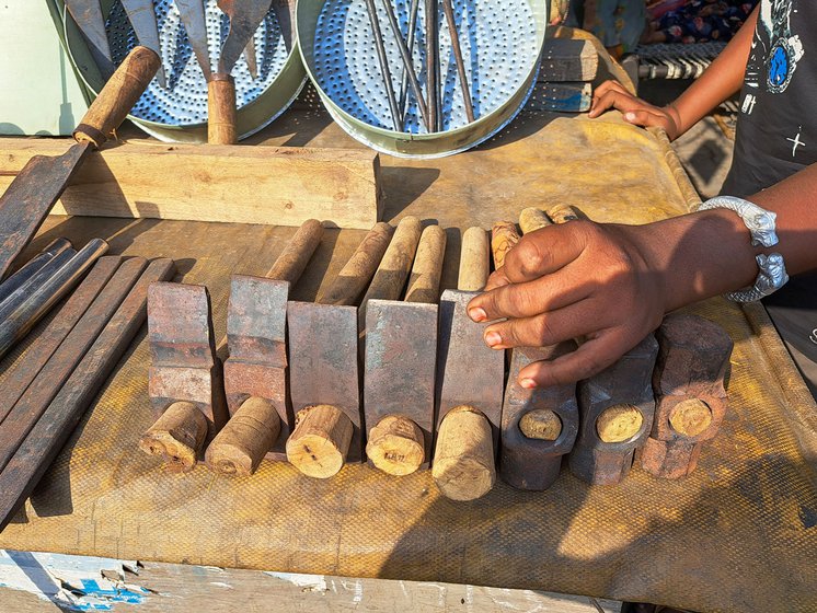 Right: Wearing a traditional kadhai ( thick bangle), Salma's son Dilshad shows the hammers and hoes made by the family