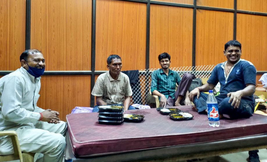 Left: Harinder Singh. Right: The cremation workers share a light moment while having dinner in a same room near the furnace