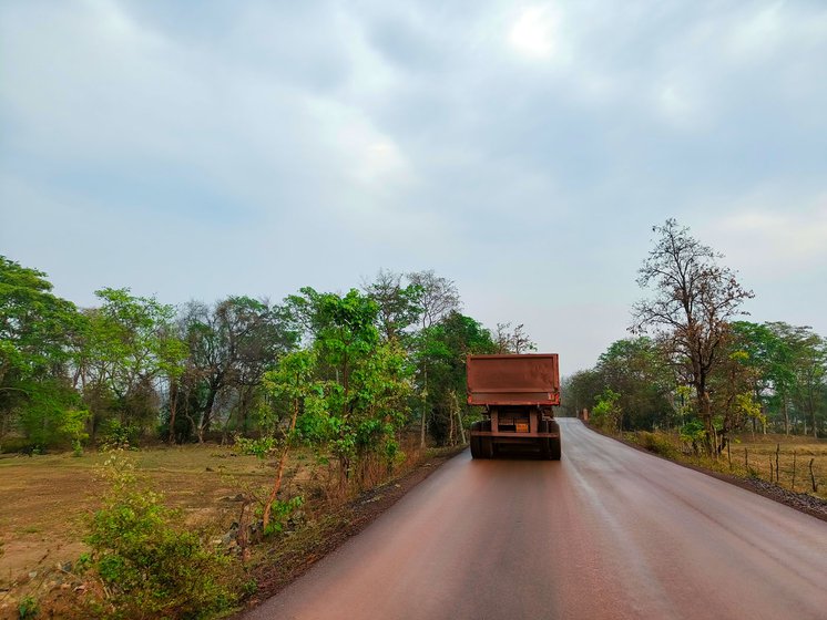 Huge pipelines (left) are being laid to take water from a lake to the Surjagarh mines even as large trucks (right) ferry the iron ore out of the district to steel plants elsewhere