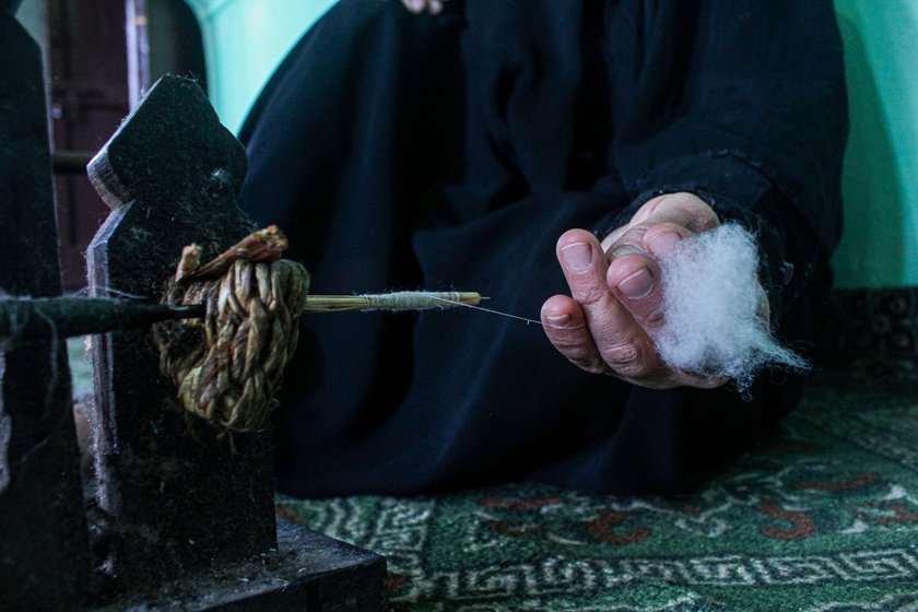 Right: It is then spun on a spindle made of dried grass stems