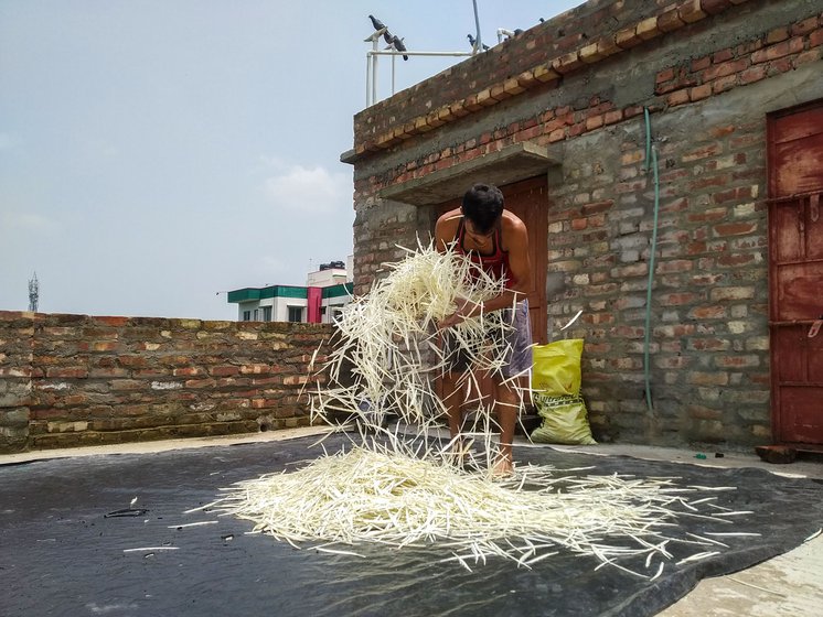 Ranjit scrubs the feathers batch by batch in warm soapy water. 'The feathers on a shuttle have to be spotless white,' he says. On the terrace, the craftsman lays out a black square tarpaulin sheet and spreads the washed feathers evenly. Once they are dry, they will be ready to be crafted into shuttlecocks.