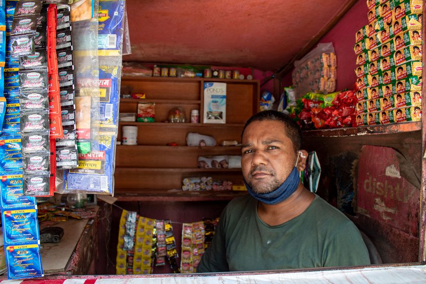 Ramvati in the colony where she does domestic work. With the kiosk (right) shut during the lockdown, the household had run on her earnings