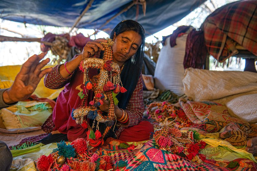 Munabbar Ali (left) and Maruf Ali (right) showing the handicrafts items they have made with Bakarwal wool