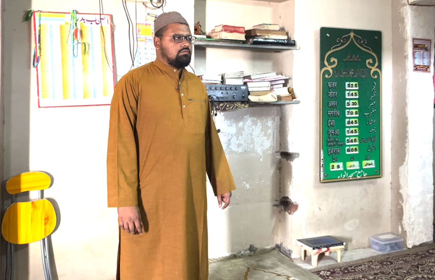 At his home (right) in Anwa village