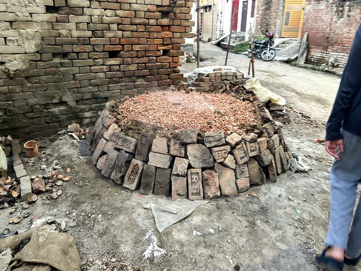 Left: The bhatti (kiln) outside the Kumharon ka mohalla in the village.