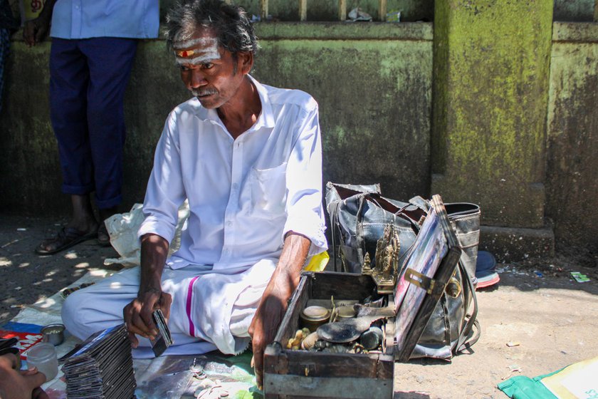 Kili Josyam uses a parrot to tell fortunes.