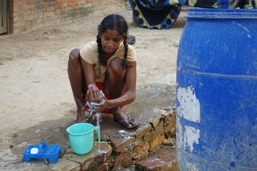 After finishing all her chores, Kiran gets ready for school.