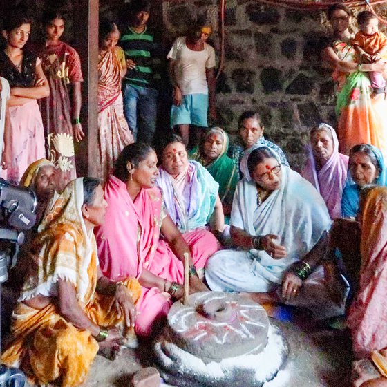 Sulabai Ravishankar Jadhav, the lead singer of the group, explains the rhythms of the songs and ensures synchrony as the other singers join her