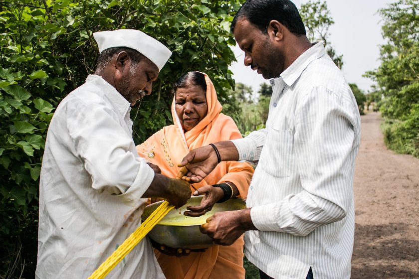 The Bhore family – Devu (wearing cap), Nandubai  and Amit  – craft ropes for farmers. There’s been no work now for weeks 

